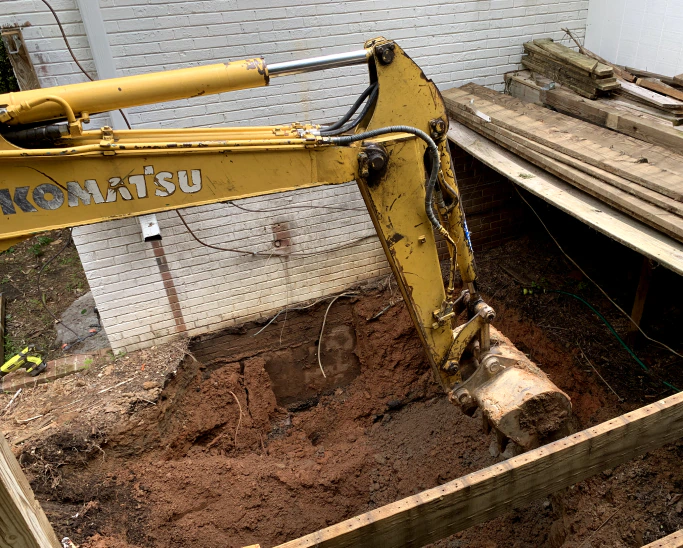 excavator digging ground soil